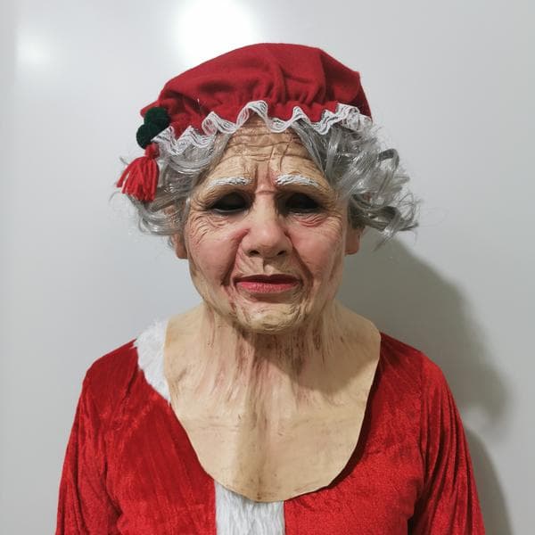 Julenisse dukke, julelatexmaske, julenissemaske, realistisk julenissemaske, iført en rød nisselue for å delta på festen