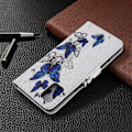 Pikkukuva 2 / 2: Wonderland Samsung Galaxy A51 flip kuoret - Sininen Perhonen Multicolor