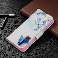 Miniatyrbillede 2 af 2: Wonderland Samsung Galaxy S21 flip etui - sommerfugl og blomster Blue