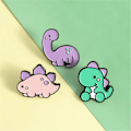 Pikkukuva 2 / 5: 3 kpl Söpö Dinosaurus Rintaneula Emali Pinsi Eläin  Pinsisetti Dinosaurus Sarja Rintaneula Väri Rintaneula Lahja Pojille Lapsille Vaatteet Hattu Reput Tarvike