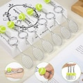 Miniatyrbild 5 av 5: 12 stycken sporttennisnyckelringar, mini metalltennisracket