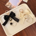 Miniatyrbild 5 av 5: Pärlstråds-rosett Nyckelringspåse Charm Keychain Väska Ornament Presenter Black