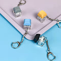 Miniatyrbild 3 av 8: Merit +1 Muyu dekompressionsnyckelring Tangentbordsknapp Fingertopp Yellow