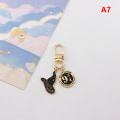 Miniatyrbillede 1 af 8: Tegneseriefigurer metal nøglering Magic Business School Pendant Ke A7
