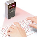 Miniatyrbild 1 av 2: Bärbar Bluetooth Virtuell Laser Tangentbord Trådlös Projektor Tangentbord Med Musfunktion För iphone Surfplatta Dator Telefon