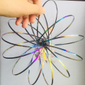Miniatyrbillede 5 af 5: 3D Flow Ring Legetøj Spring Infinity Arm Jonglør Drøm Dans Stress Relief Legetøj