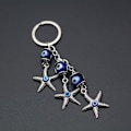 Miniatyrbillede 2 af 5: Lucky Starfish formet nøglering Devil Blue Eye nøglering bil nøglering charme gave