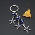 Miniatyrbillede 3 af 5: Lucky Starfish formet nøglering Devil Blue Eye nøglering bil nøglering charme gave