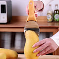 Pikkukuva 5 / 5: Mangon halkaisija, paloiteltu mango, leikkurit, mangon valmistustyökalu, mangon kaivamislusikat