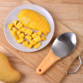 Pikkukuva 2 / 5: Mangon halkaisija, paloiteltu mango, leikkurit, mangon valmistustyökalu, mangon kaivamislusikat
