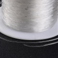 Miniatyrbillede 2 af 2: 1 Stor rulle á 100 mt. transparent elastisk tråd 0,7 mm. Ø