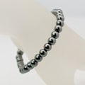 Miniatyrbillede 2 af 2: Handgjord Elastisk Armband med 6 mm. hematit(ej magnetiskt) DarkGrey hematit