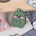 Miniatyrbillede 4 af 5: Dww-Pakke med 10 stryge- eller sy-på broderede patches