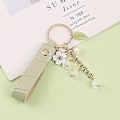 Miniatyrbillede 3 af 5: Nukaf Lily Of The Valley Design Blomster Nøgleringe Læderpung Bil Nøglering Til Kvinder Piger Gaver