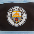 Pikkukuva 5 / 5: Manchester Cityn poikien urheilutakki ja set 8-9 Years