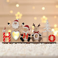 Miniatyrbillede 2 af 5: Lysende juledekorationer i udhulet træ