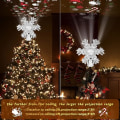 Miniatyrbilde 2 av 5: Juletrétopp - Snøfnugg juletrétopp belyst med 3D roterende snøfnugg - LED hul glitterprojektor - Juletrétopp for juletredekorasjoner (Sølv)