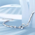 Miniatyrbillede 5 af 5: Iøjnefaldende armbånd i kobber med dobbelt hjerte til kvinder