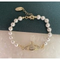 Miniatyrbillede 2 af 3: Gylden Saturn Hvid Perle Armbånd Kvinders Enkle Mode Armbånd