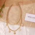 Miniatyrbild 2 av 5: Guld Halsband / Choker med 2 st Kedjor & 5 olika Berlocker Guld