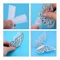 Miniatyrbillede 3 af 4: 24 stk 3D Butterfly Vægstickers 3 Størrelser Butterfly Vægstickers Vægskilt til Soveværelse Fest Bryllup Dekorationer Sølv Silver