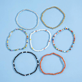 Miniatyrbillede 3 af 5: Enkeltlags håndlavede geometriske ankelkæder, alsidige elastiske armbånd med kontrasterende farvede perler til kvinder (14 stk.)