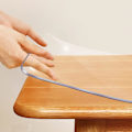 Miniatyrbillede 2 af 5: 50*100cm Klar Plastik Spisebord Beskytter Dug Bordplade Pad Måtte Bordplade Dæksel Vandafvisende PVC Rektangulær Træmøbler