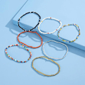 Miniatyrbillede 2 af 5: Enkeltlags håndlavede geometriske ankelkæder, alsidige elastiske armbånd med kontrasterende farvede perler til kvinder (14 stk.)
