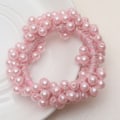 Miniatyrbild 3 av 4: Elegant Hårsnodd med Rosa Pärlor - Förvandla Din Hästsvans Rosa