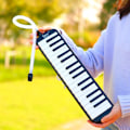 Miniatyrbilde 4 av 7: 32 tangenter Melodica Piano Keyboard Stil Musikal Instrument Harmonica Munn Orgel Med bærepose