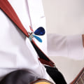 Miniatyrbilde 4 av 5: Metallgitarplekter med plekterholder for akustisk gitar, banjo og ukulele.