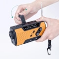 Miniatyrbild 2 av 5: （Orange） Nödradiomed FM AM Vev, ny solcellsdriven multifunktionsradio för utomhusbruk med 2000mAh som powerbank/läslampa med 4 LED/LED-ficklampa