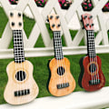 Miniatyrbild 4 av 4: Barnens Mini Fyrasträngade Gitarr Instrument (Beige) 1 Styck Beige