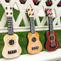 Miniatyrbild 3 av 4: Barnens Mini Fyrasträngade Gitarr Instrument (Beige) 1 Styck Beige