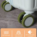 Pikkukuva 4 / 5: Matkalaukkujen pyöränsuojukset Silikoniset äänettömät suojukset useimpien 8 pyörivän pyörän matkalaukkuihin Military Green 1pcs