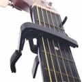 Capo för gitarr