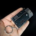 Miniatyrbillede 4 af 8: Mini Foldbar Gummibånd Legetøj Gummibånd Launcher Legetøj Nøglering Foldbar Håndlavet Legetøj til Voksne Børn