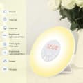 Miniatyrbild 3 av 5: Light-Controlled Alarm Clock Lamp: Simulates sunrise for gentle awakening; features multi-color ambient lighting; large screen with time display.