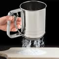Fine-mesh flour sieve in stainless steel, smooth handle, easy to sift