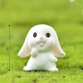 Pikkukuva 2 / 5: Sarjakuvapupun miniatyyrikoristeet, kanin puutarhakasvien hartsitarvikkeet 5 Squint Rabbit No. 6