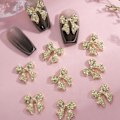 Miniatyrbild 1 av 4: 10 st, Guld Rosett Nagelberlocker 3D Legering Nagelkonst Berlocker Söta Rosettknutar Glänsande Nageldekorationer Pläterade Berlocker för Naglar Guld Nagelberlocker för Akrylnaglar
