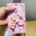 Pikkukuva 1 / 8: Kawaii Sarjakuvanukke Avaimenperä Laukun Koriste Yleiskäyttöinen Matkapuhelin A9