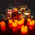 Pikkukuva 3 / 4: LED Kurpitsa Tuikkukynttilät, Oranssit Korkeat Valot (12 kpl, Oranssi)