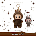Miniatyrbild 2 av 4: Pop Mart Labubu The Monsters – Spännande Macaron Plysch Nyckelring Serie (1 Blind Box, 17 cm) Item 1:Chestnut cocoa