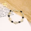 Miniatyrbild 2 av 5: Fashionabla Metal Love Heart Hollow Inlagt hjärta armband Black