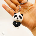 Miniatyrbillede 7 af 8: e Anime Panda nøglering til kvinder mænd modetaske vedhæng adgang A4