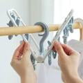 Miniatyrbild 6 av 7: Bärbar Hängande Torkställning för Tvätt, Vikbar Klämma och Dropphängare med 12 Klämmor för Babykläder Handskar, Utrymmesbesparande Design, Långvarig