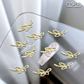 Pikkukuva 1 / 8: 10 kpl DIY Nail Art Decoration 3D Sliver / kultainen rusetti kynsipora 10Pcs Gold 7*18mm