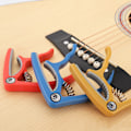 Miniatyrbillede 2 af 5: Plast Stålgitarr Capo Klassisk Akustisk Gitarr Ukulele Tuning Clamp Nybörjare Övning Musikverktyg Svart