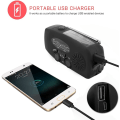 Pikkukuva 5 / 5: Vevradio aurinkokennoilla Taskulamppu ja 2000mAh Powerbank punainen SOS musta